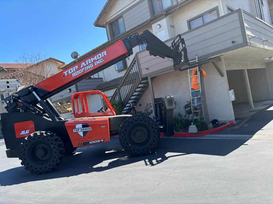 Crane lifting tile at Casa de Oaks HOA
