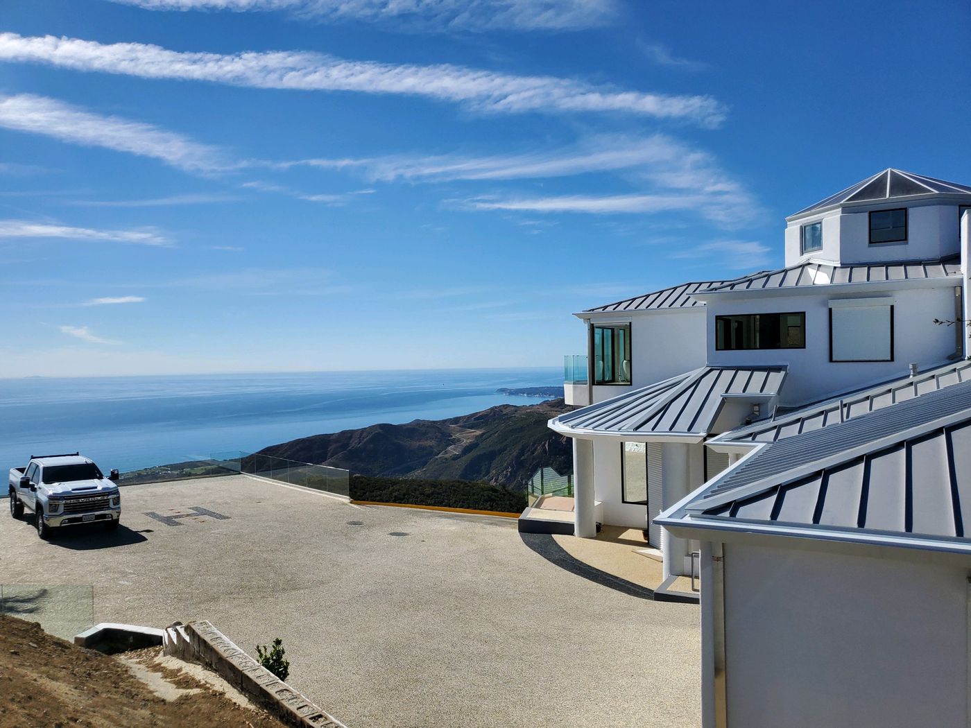 Standing seam metal roof on a coastal ridgeline estate above Malibu