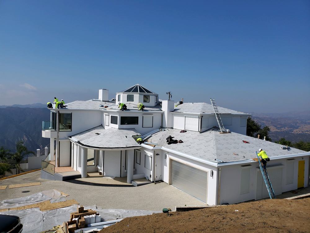 Two-ply underlayment installed across a hillside estate roof